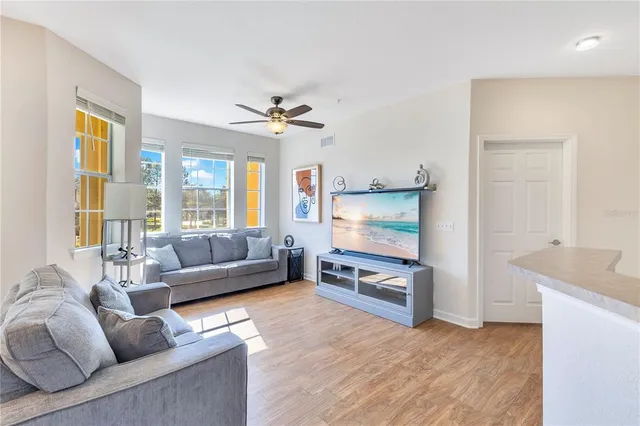 a living room with furniture and a large window