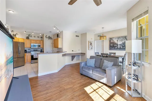 a view of a dining room with furniture wooden floor and a chandelier