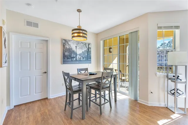 a view of a dining room with furniture window and outside view