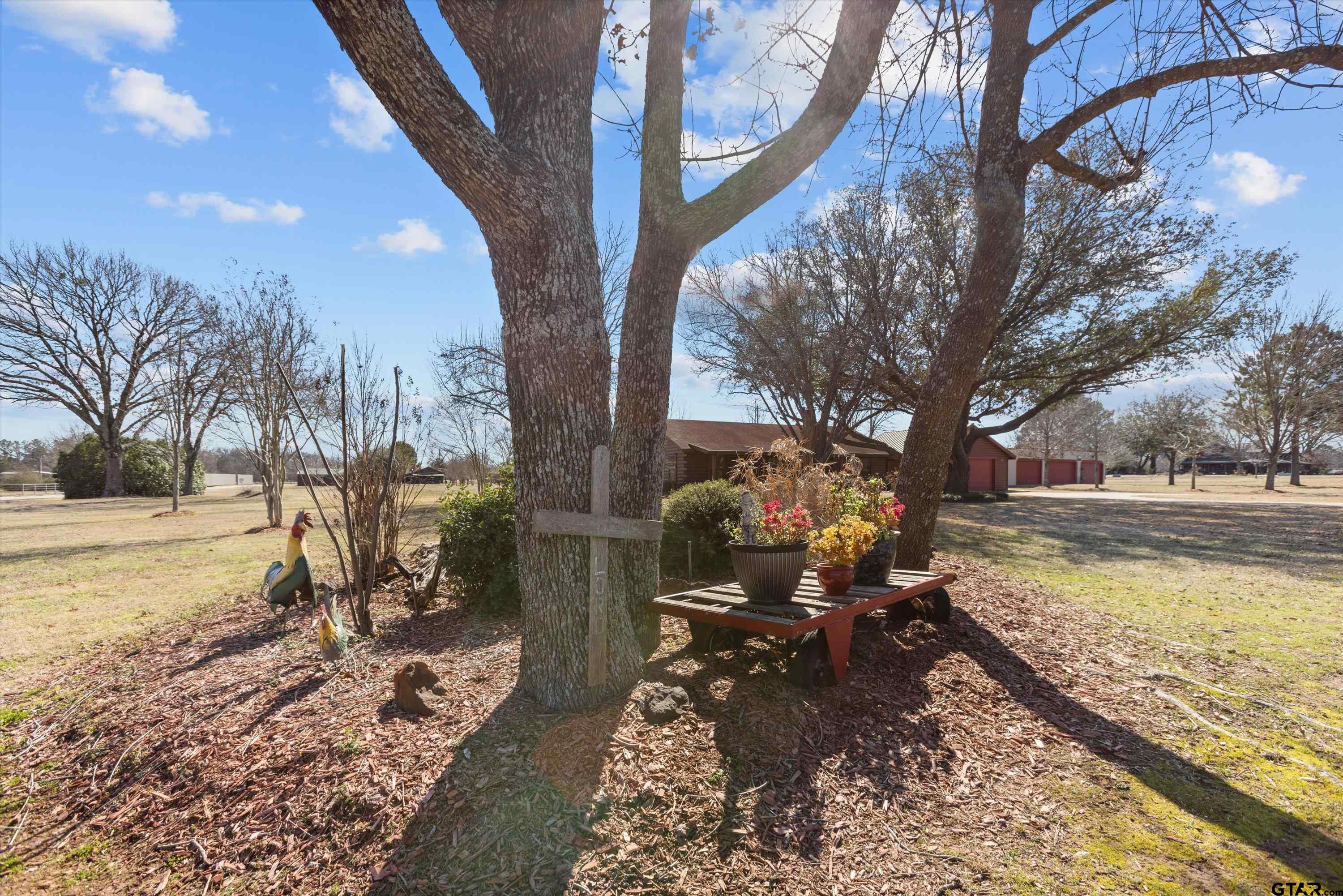 129 Private Road 5569 Alba, TX 75410 - Photo 17 of 40 a view of a lake with a yard chairs and table on the patio