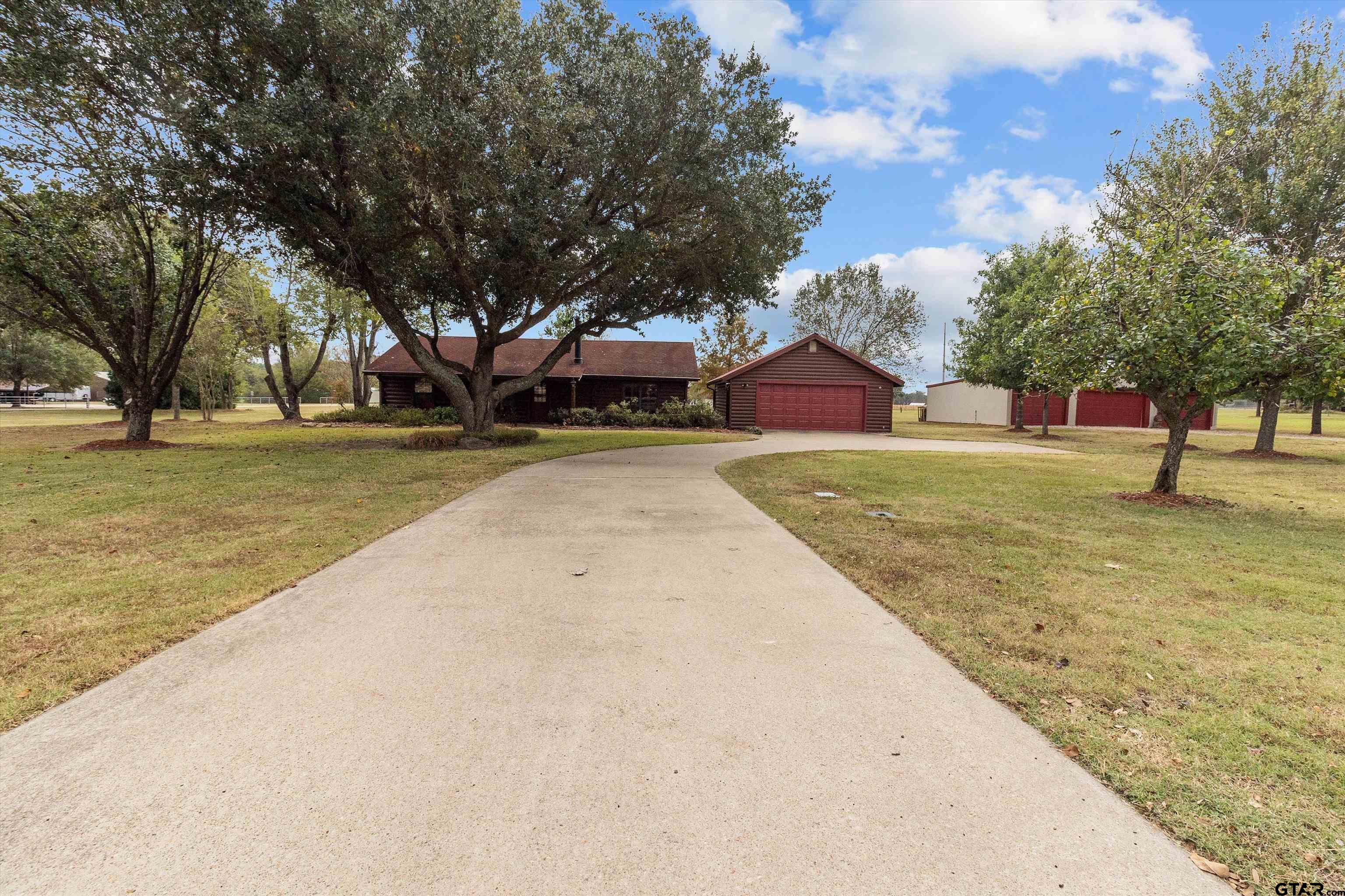129 Private Road 5569 Alba, TX 75410 - Photo 18 of 40 a view of a playground with a large tree