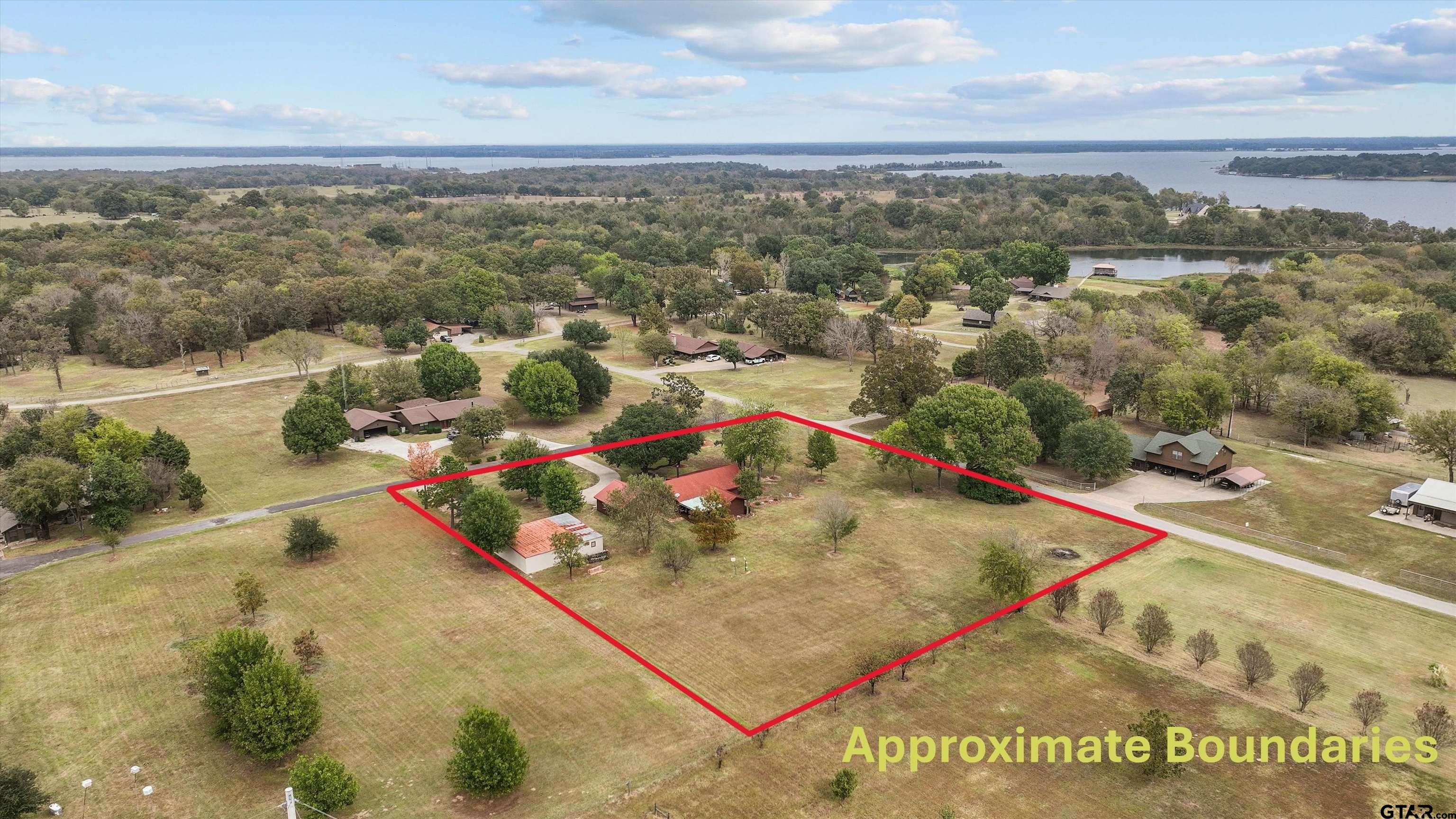 129 Private Road 5569 Alba, TX 75410 - Photo 2 of 40 an aerial view of residential houses with outdoor space