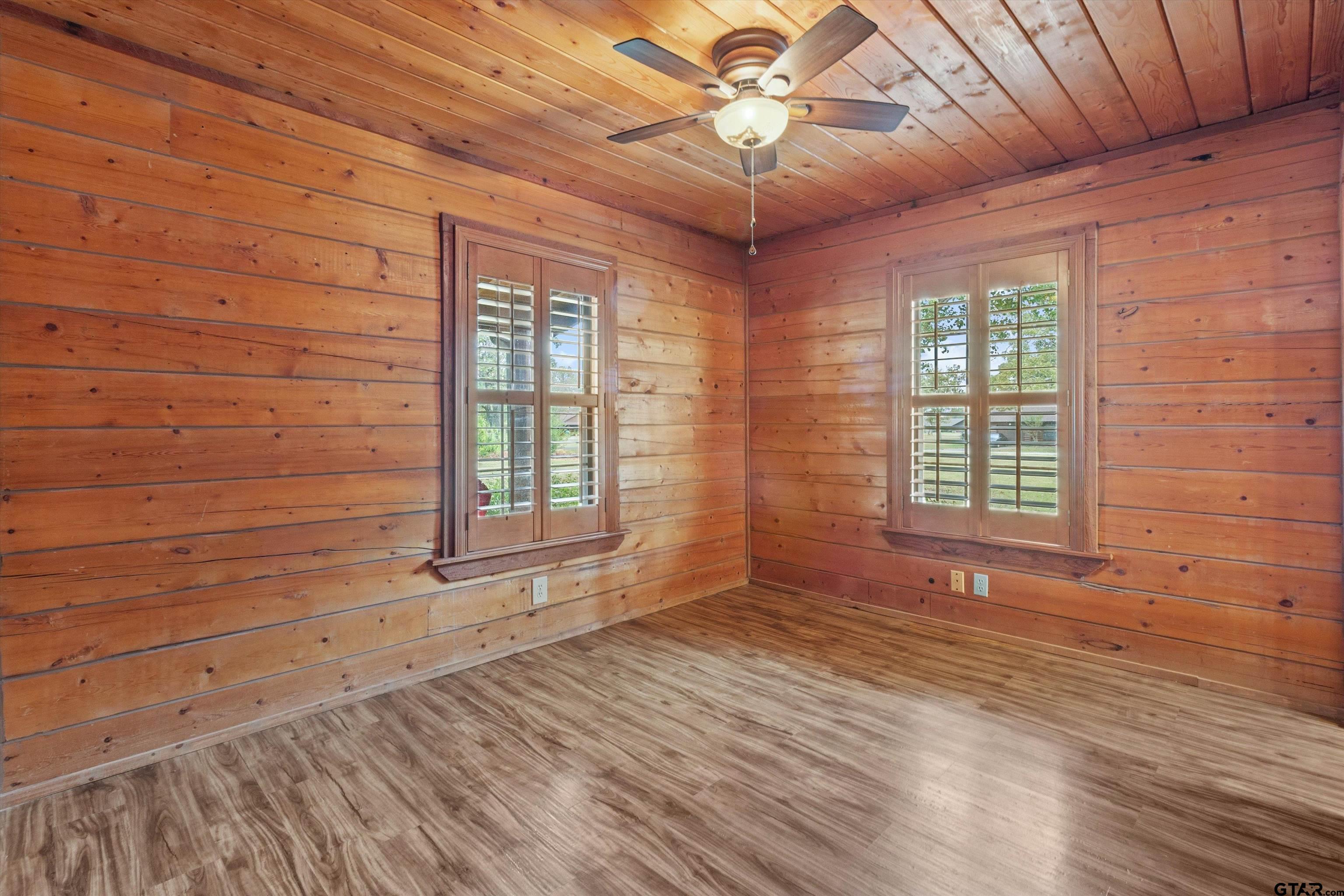129 Private Road 5569 Alba, TX 75410 - Photo 25 of 40 a view of an empty room with a window and wooden floor