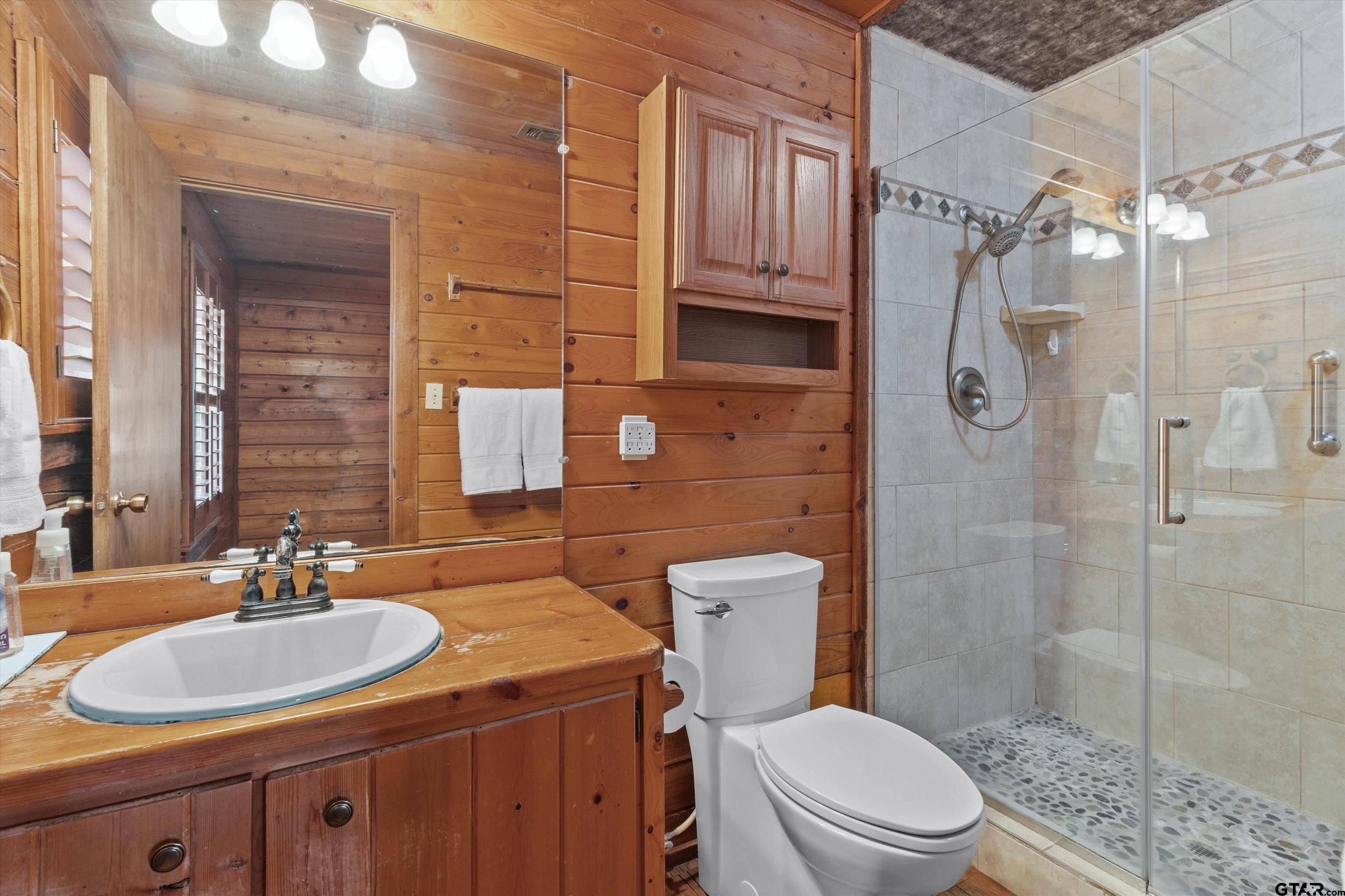 129 Private Road 5569 Alba, TX 75410 - Photo 27 of 40 a bathroom with a sink toilet and shower