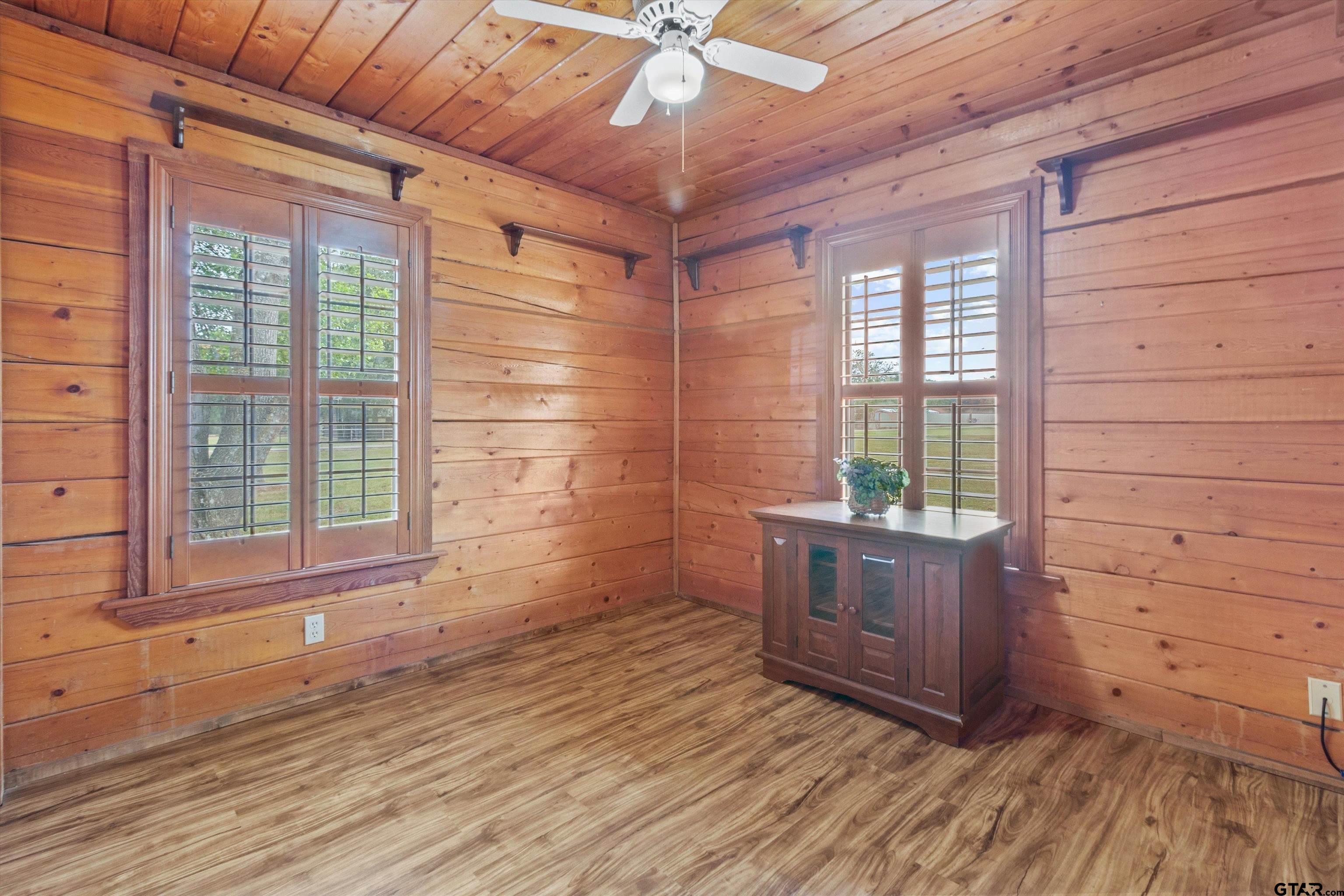 129 Private Road 5569 Alba, TX 75410 - Photo 30 of 40 a view of empty room with wooden floor and fan