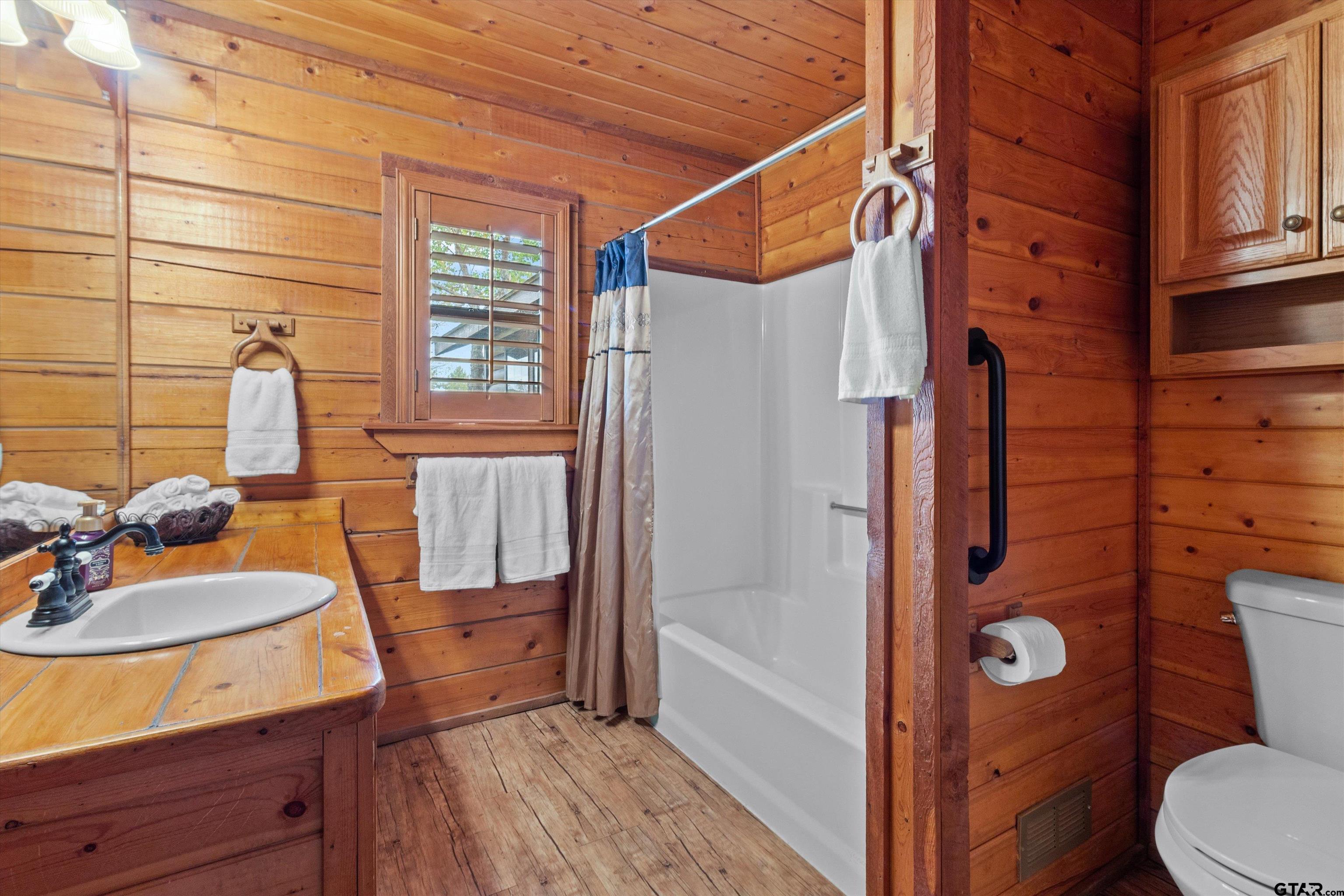 129 Private Road 5569 Alba, TX 75410 - Photo 31 of 40 a bathroom with a sink a toilet and shower