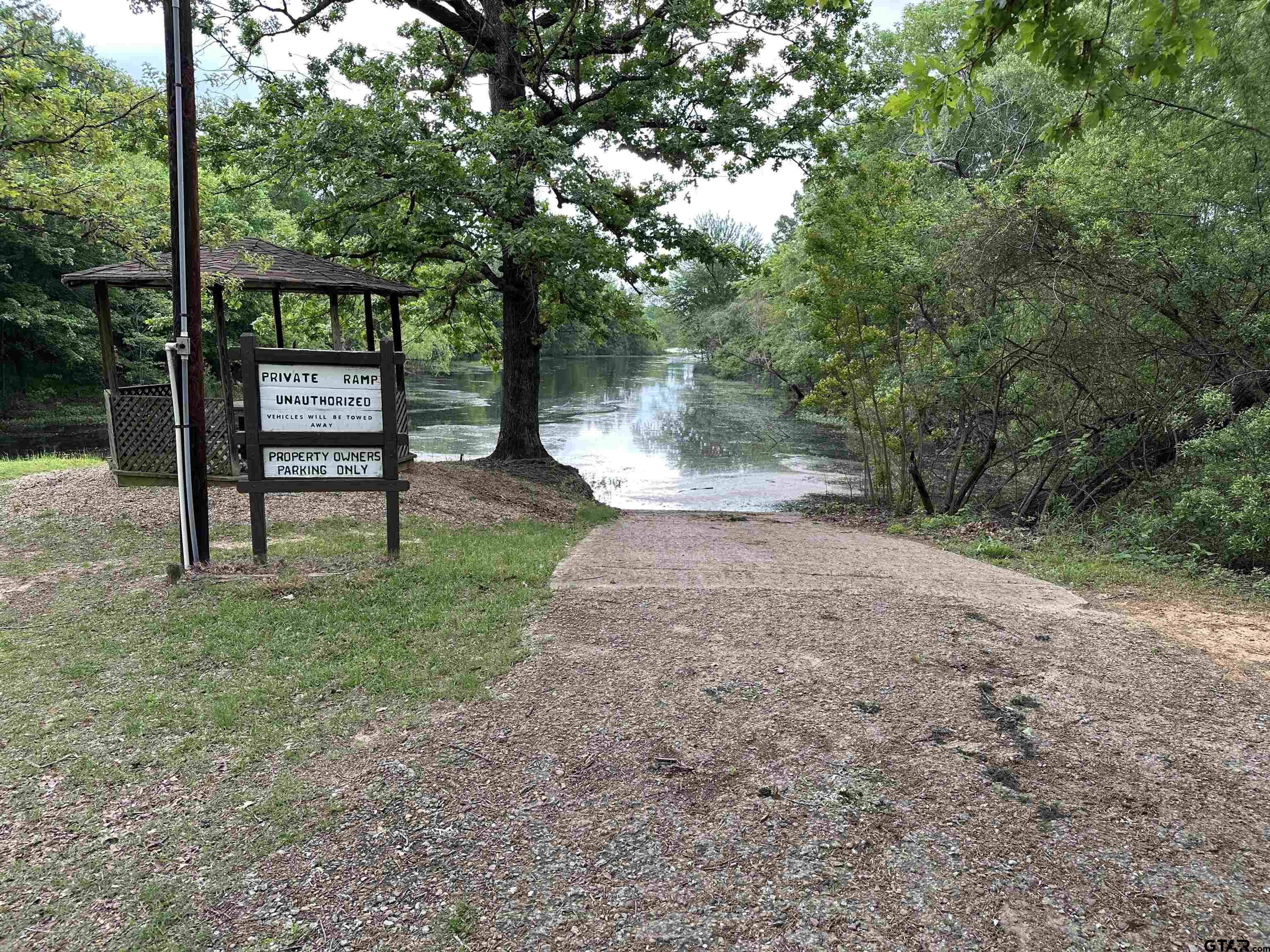 129 Private Road 5569 Alba, TX 75410 - Photo 40 of 40 a view of a bench sitting in the middle of a yard