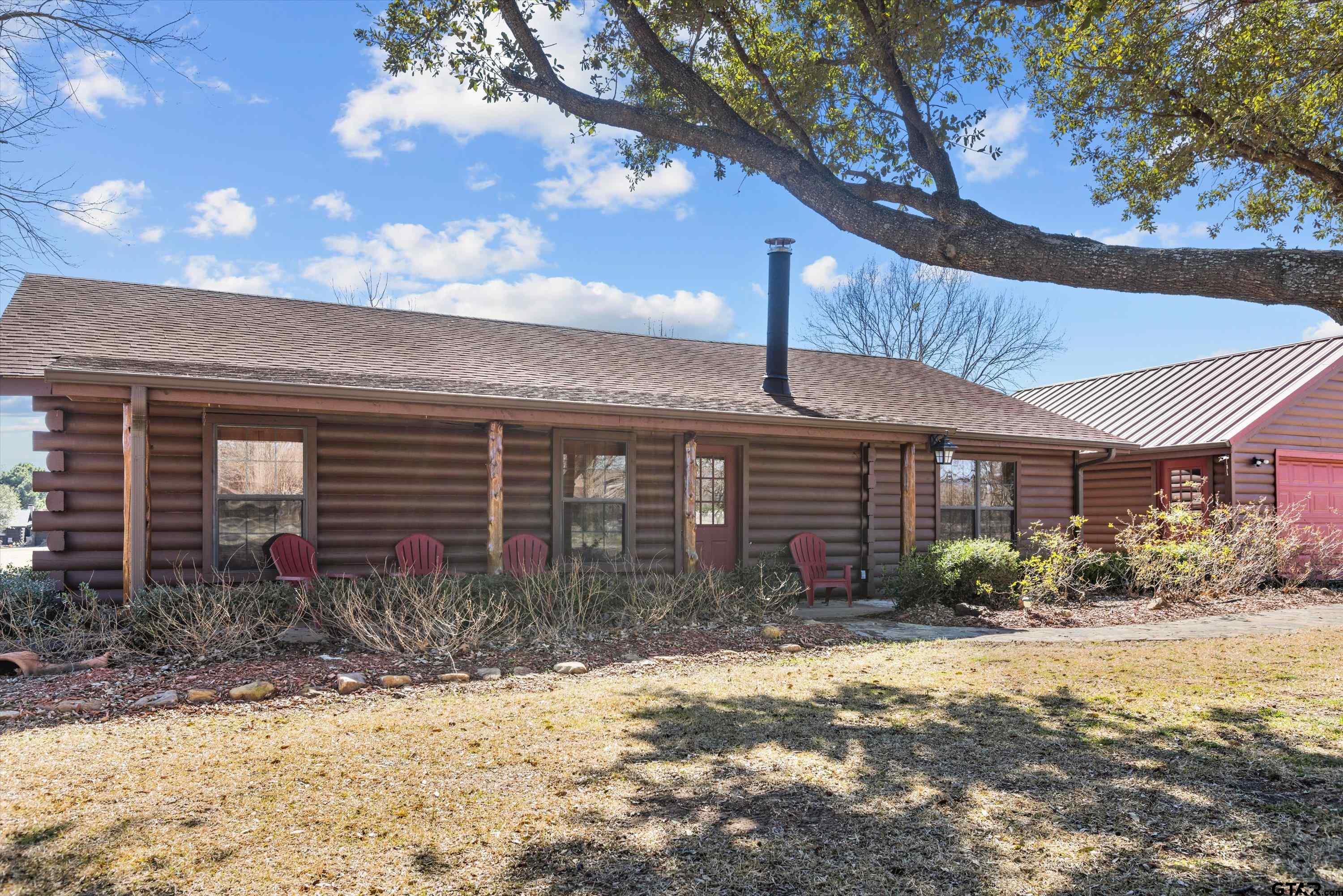 129 Private Road 5569 Alba, TX 75410 - Photo 4 of 40 a front view of a house with garden