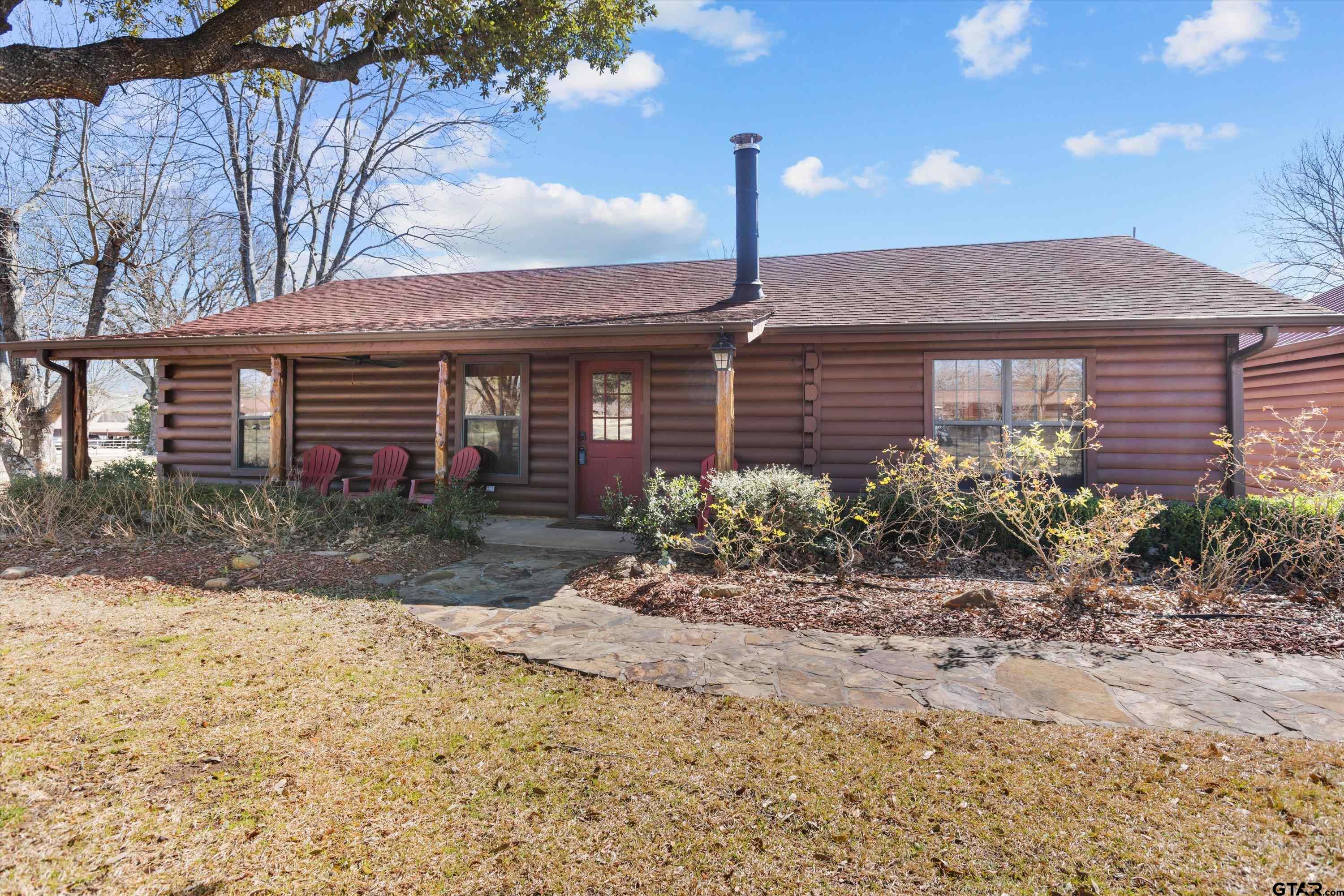 129 Private Road 5569 Alba, TX 75410 - Photo 5 of 40 a front view of a house with garden