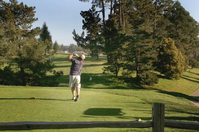 a view of a hallway with a hardwood floor