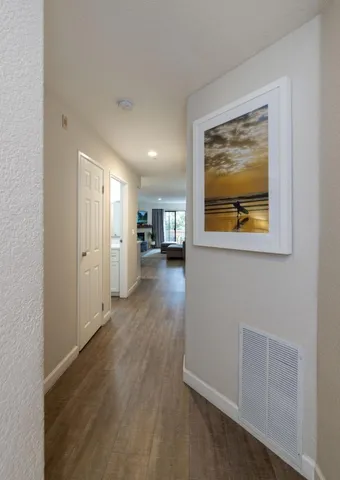 a bedroom with a bed and a lamp