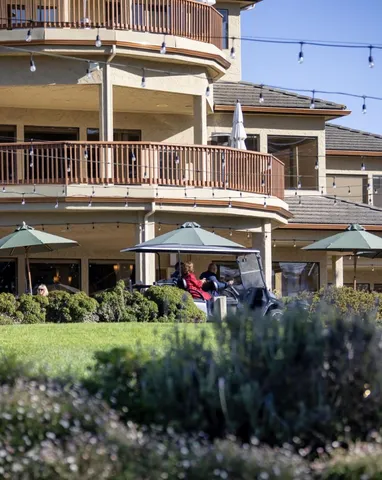 front view of a building with a garden