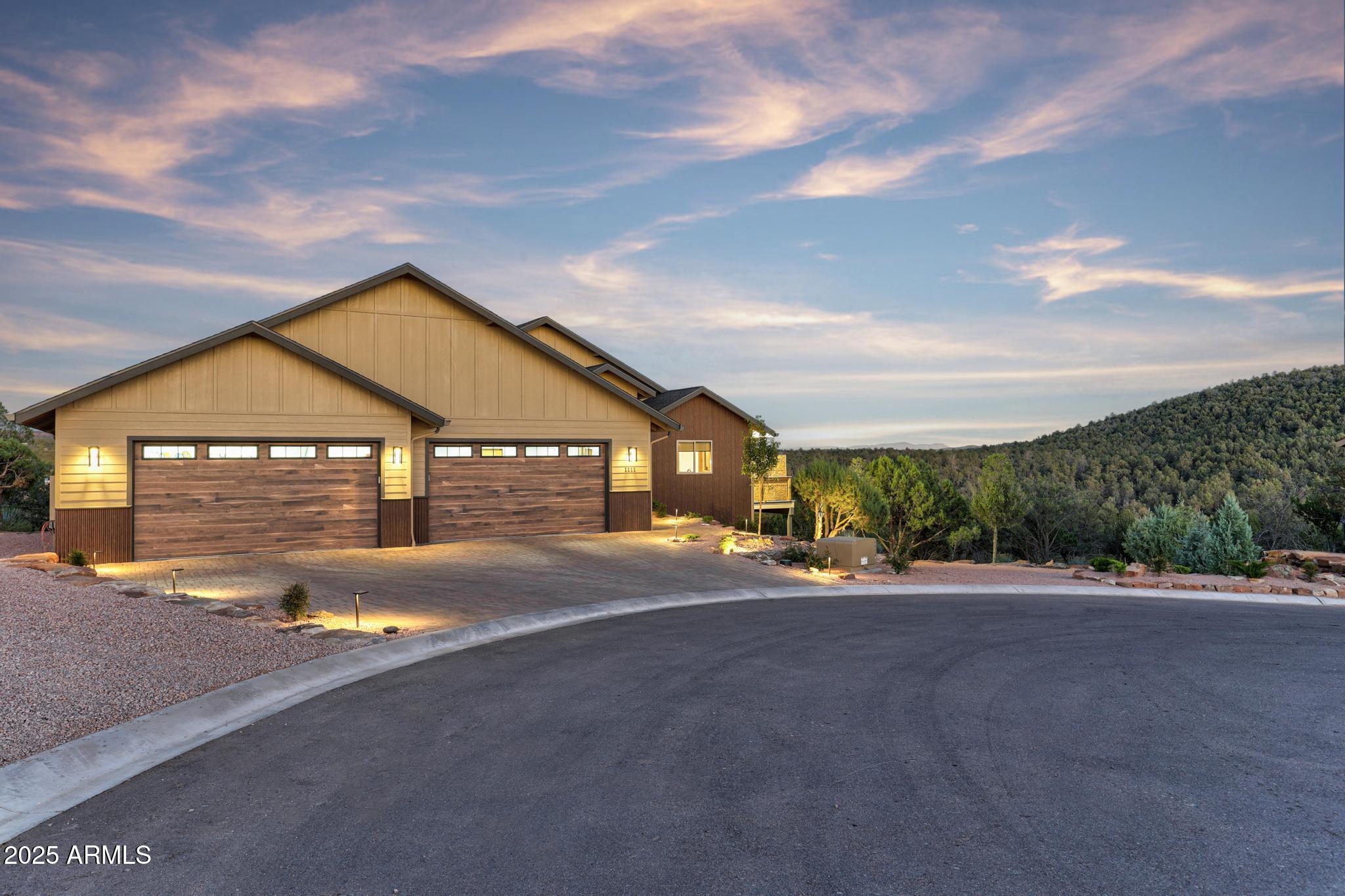a view of a house with a yard and garage