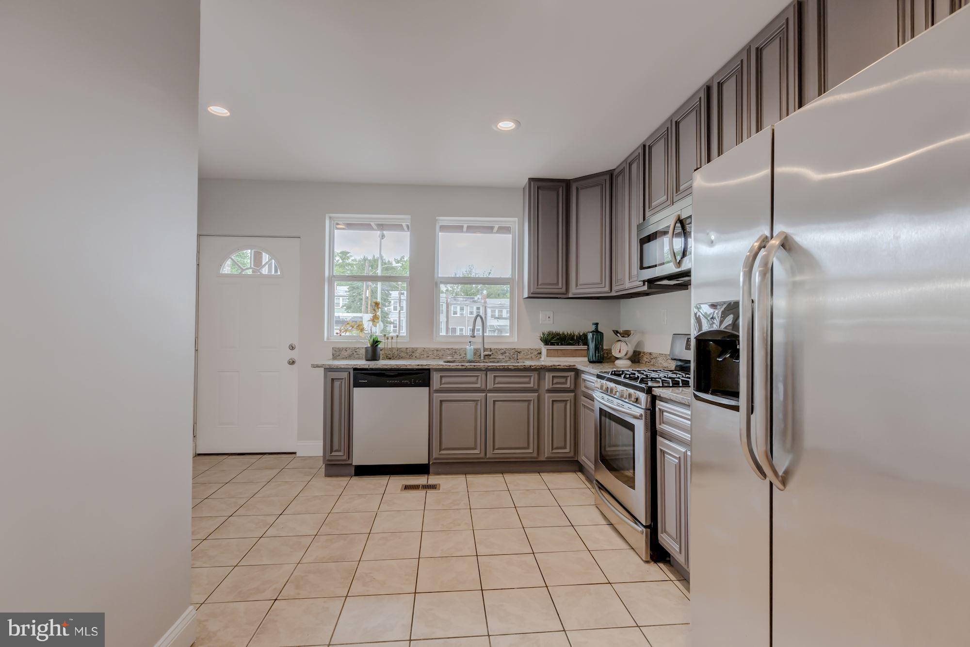 214 Bryant Street Northeast Washington, DC 20002 - Photo 11 of 29 Kitchen back door leads to lower deck and parking