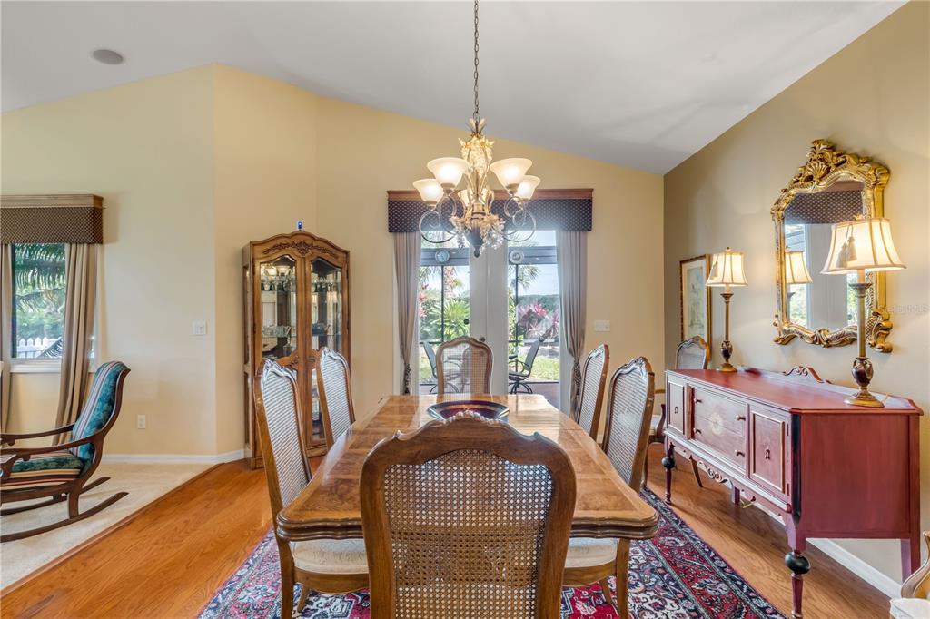 1098 Red Maple Way New Smyrna Beach, FL 32168 - Photo 11 of 78 a view of a dining room with furniture and a chandelier