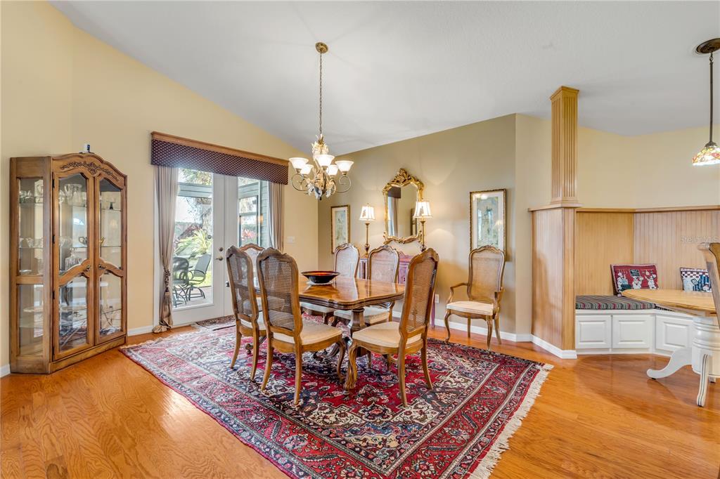 1098 Red Maple Way New Smyrna Beach, FL 32168 - Photo 12 of 78 a view of a dining room with furniture window and wooden floor
