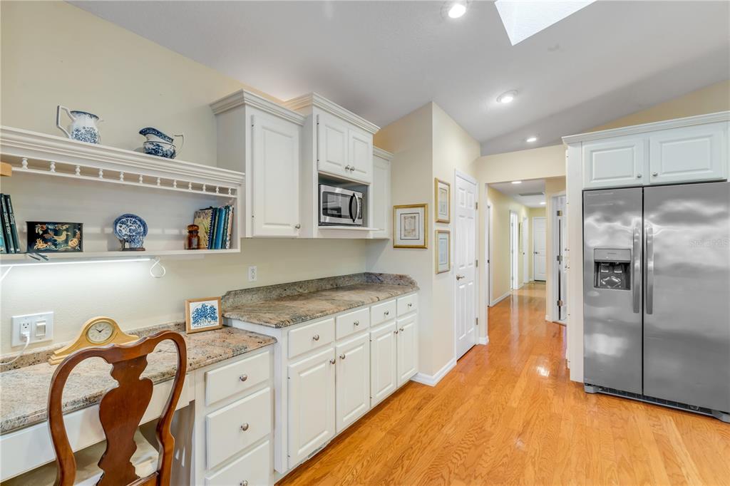 1098 Red Maple Way New Smyrna Beach, FL 32168 - Photo 19 of 78 a large kitchen with stainless steel appliances granite countertop a sink and cabinets