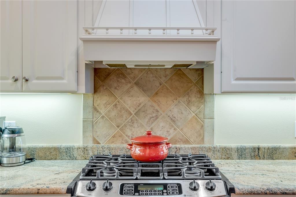 1098 Red Maple Way New Smyrna Beach, FL 32168 - Photo 25 of 78 a stove top oven sitting inside of a kitchen
