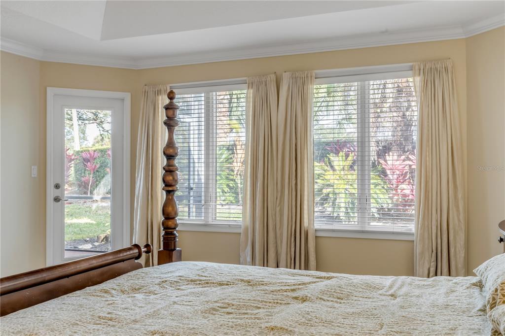 1098 Red Maple Way New Smyrna Beach, FL 32168 - Photo 26 of 78 a bedroom with a bed and a window