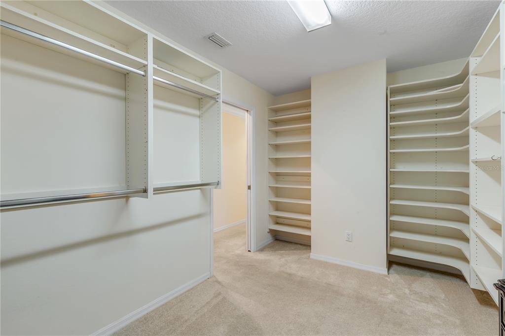 1098 Red Maple Way New Smyrna Beach, FL 32168 - Photo 31 of 78 a view of walk in closet with empty racks