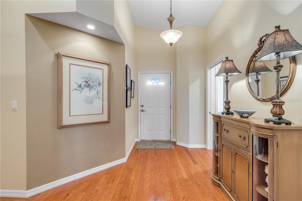 1098 Red Maple Way New Smyrna Beach, FL 32168 - Photo 48 of 78 a view of a bedroom with a bed and wooden floor