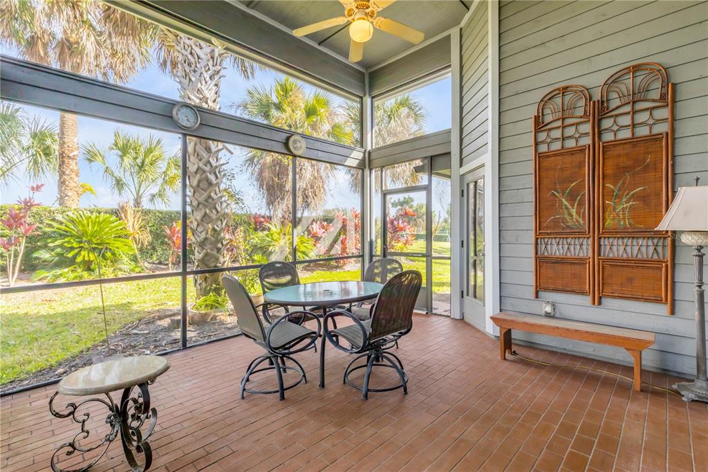 1098 Red Maple Way New Smyrna Beach, FL 32168 - Photo 51 of 78 a dining room with wooden floor and furniture