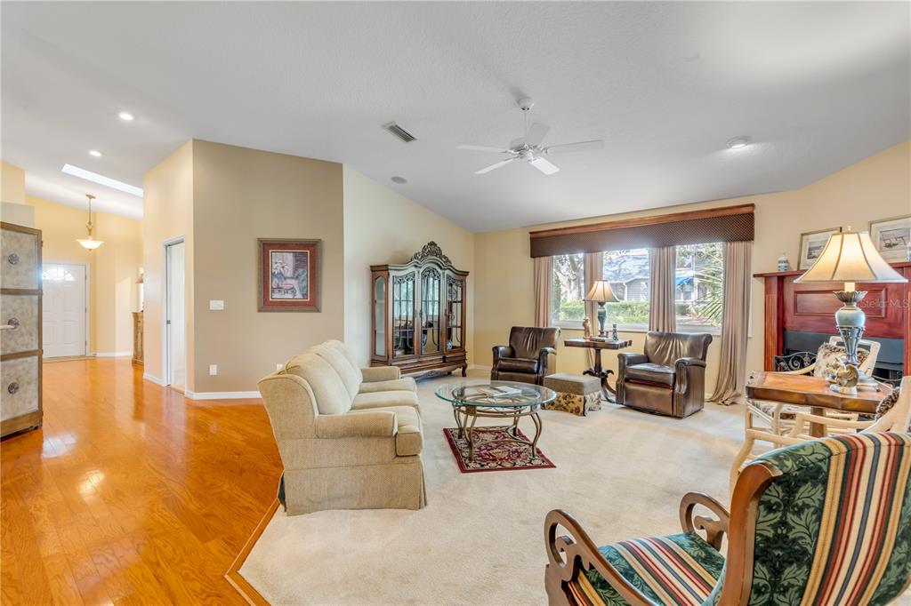 1098 Red Maple Way New Smyrna Beach, FL 32168 - Photo 9 of 78 a living room with furniture and a large window