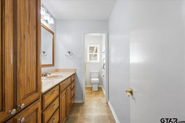 a view of a yard with snow on the road