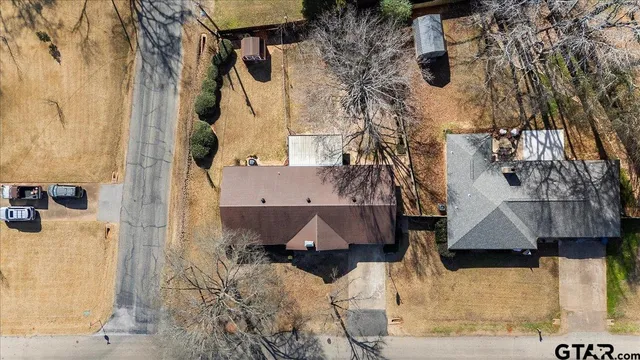 an aerial view of residential houses with outdoor space
