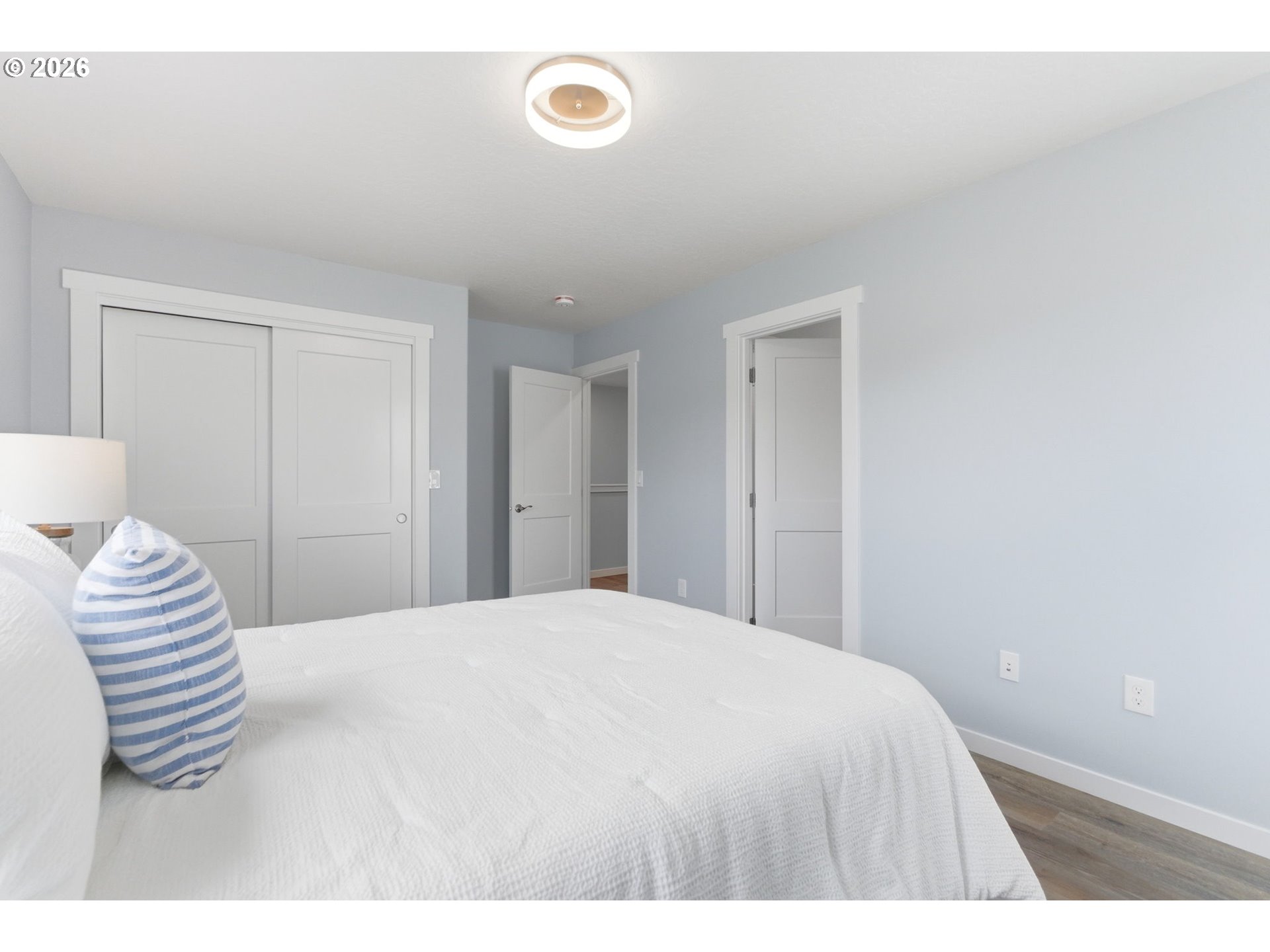 372 Southwest George Court Dundee, OR 97115 - Photo 21 of 33 a bedroom with a white bed and a chair