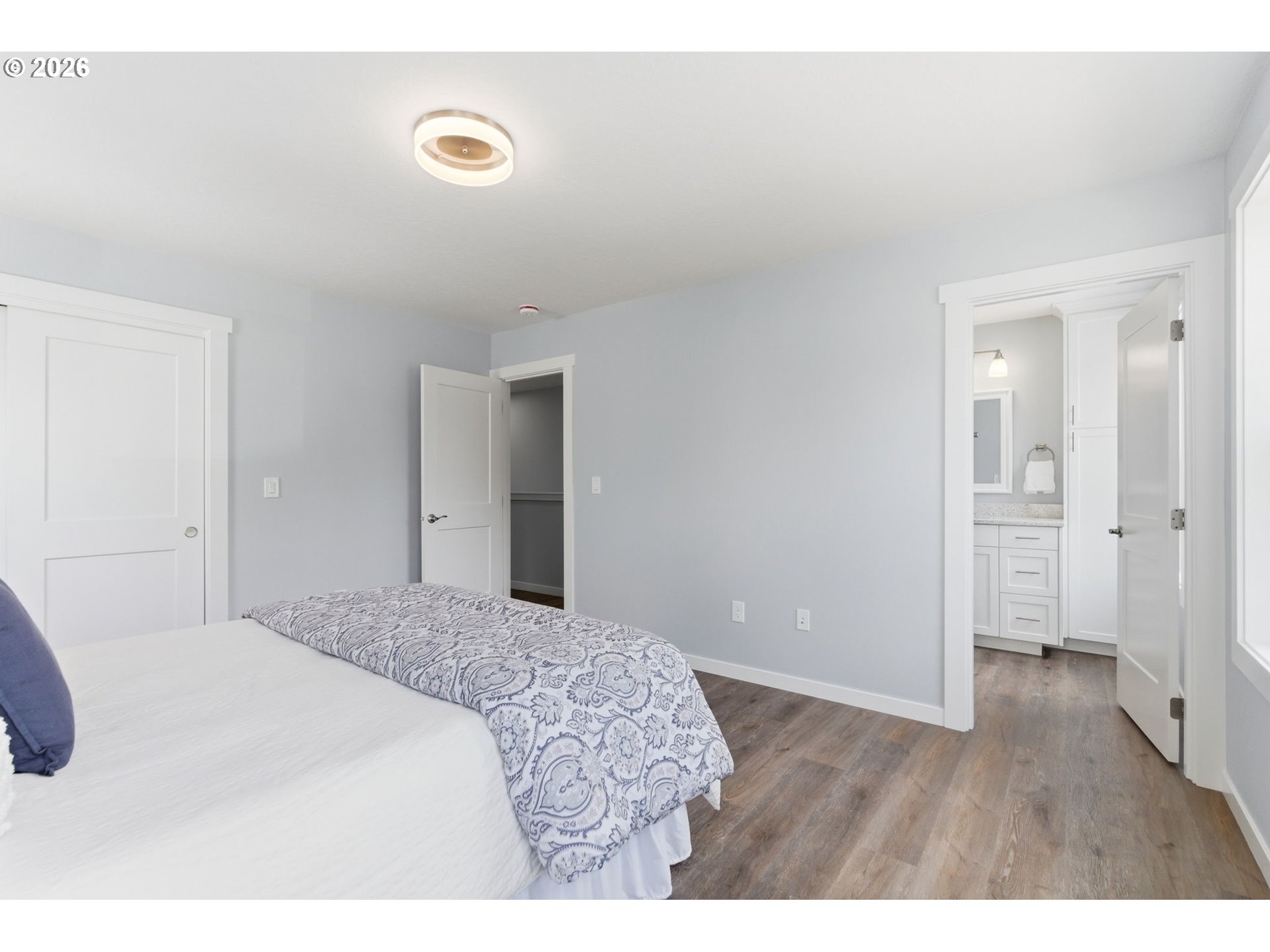 372 Southwest George Court Dundee, OR 97115 - Photo 25 of 33 a bedroom with a bed and a painting on the wall
