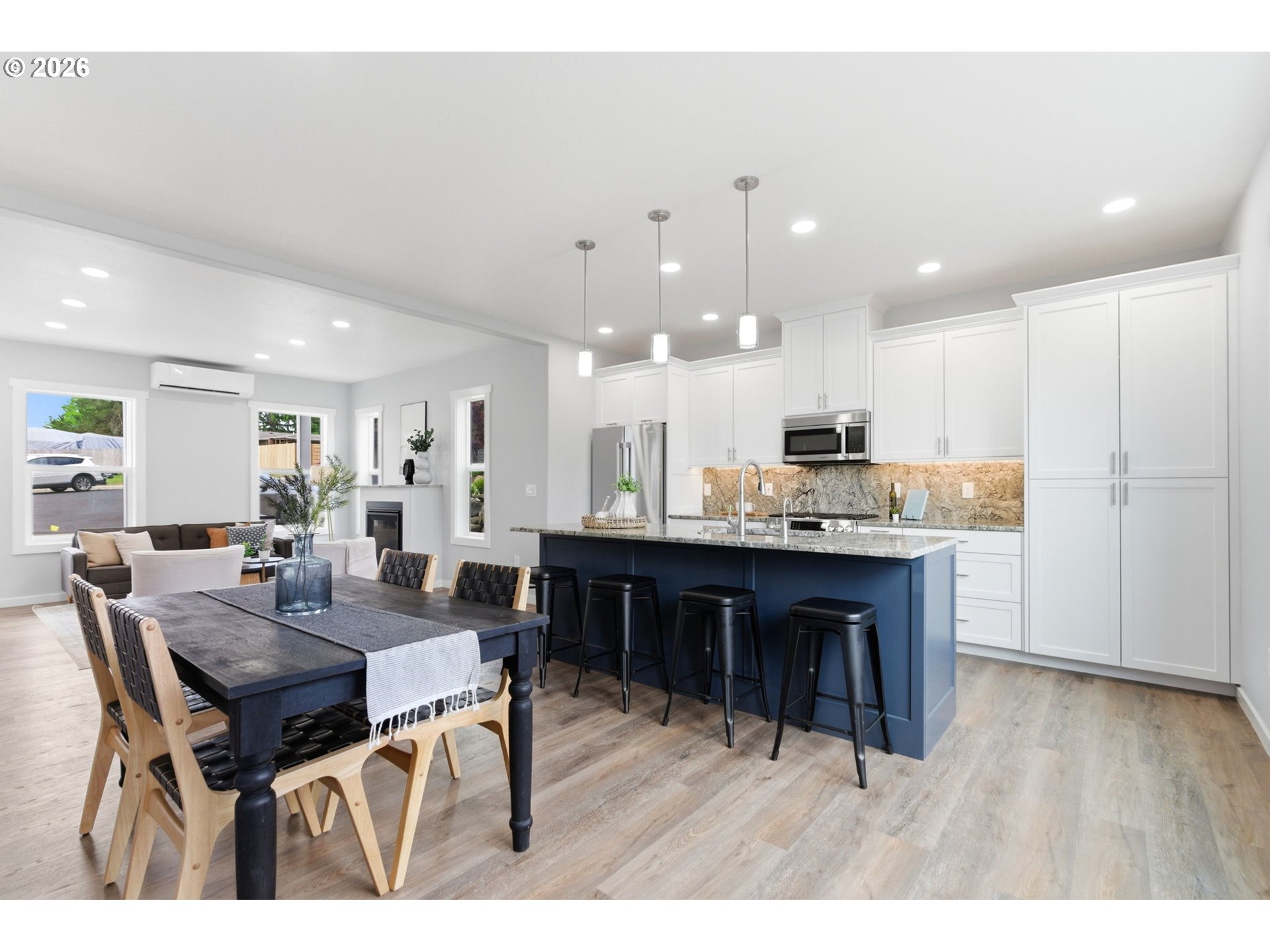 372 Southwest George Court Dundee, OR 97115 - Photo 6 of 33 a kitchen with a dining table chairs and wooden floor