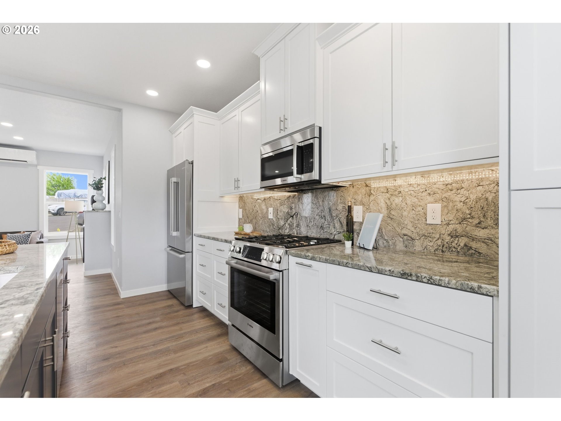 372 Southwest George Court Dundee, OR 97115 - Photo 7 of 33 a kitchen with stainless steel appliances granite countertop a stove a sink and a microwave