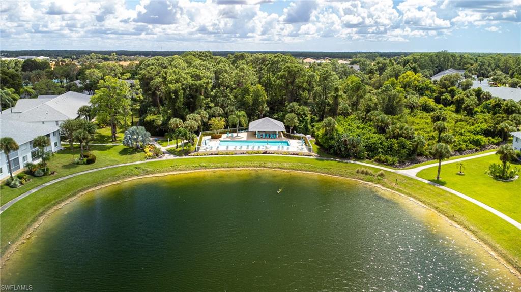448 Gabriel Circle, Unit 3310 3310 Naples, FL 34104 - Photo 27 of 29 Drone / aerial view of a llake