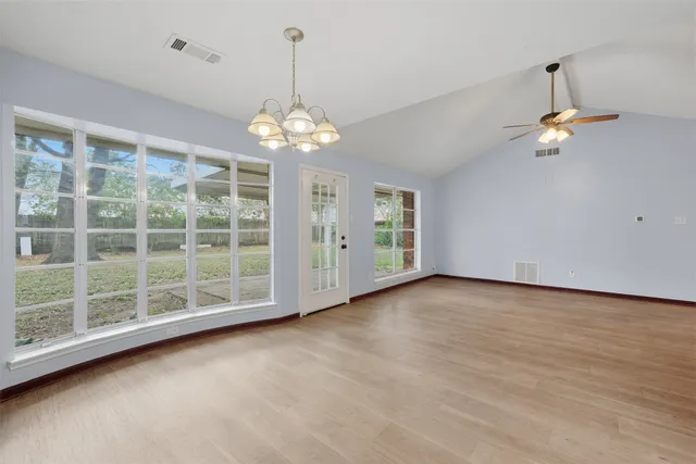 a view of empty room with windows