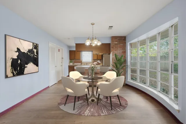 a view of a dining room with furniture window and outside view