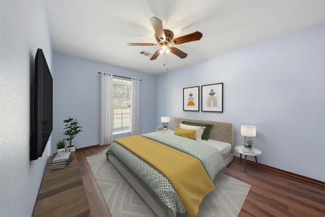 a bed room with a bed and a chandelier