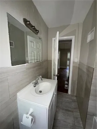 a bathroom with a sink and mirror
