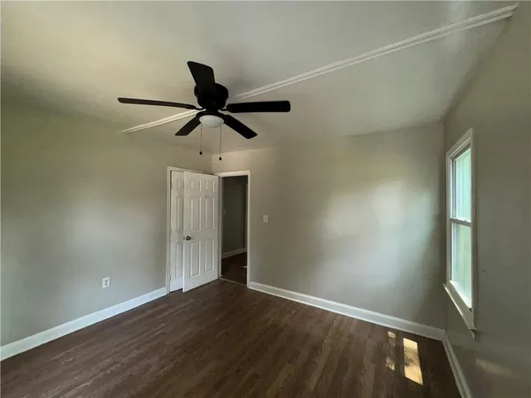 a view of room with a ceiling fan