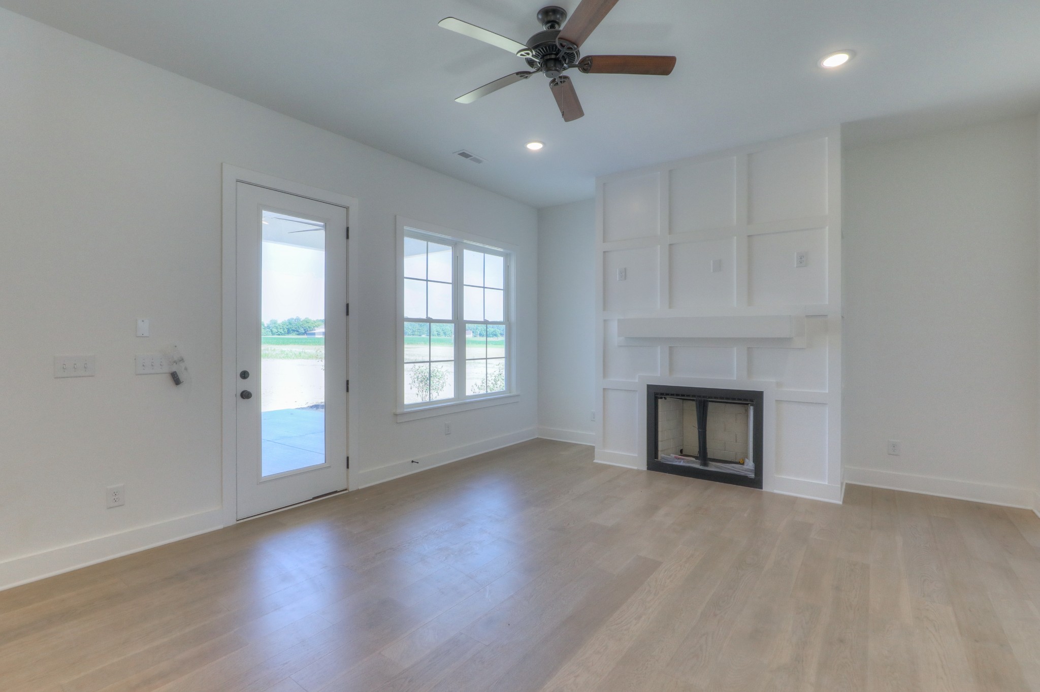 1221 Norton Road Manchester, TN 37355 - Photo 4 of 34 an empty room with windows fireplace and a sink