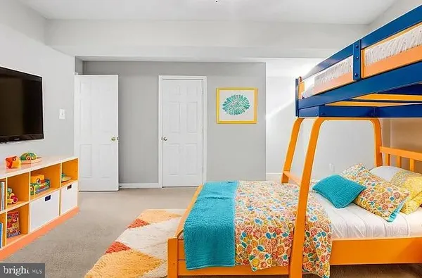 a bedroom with a bed and a couch