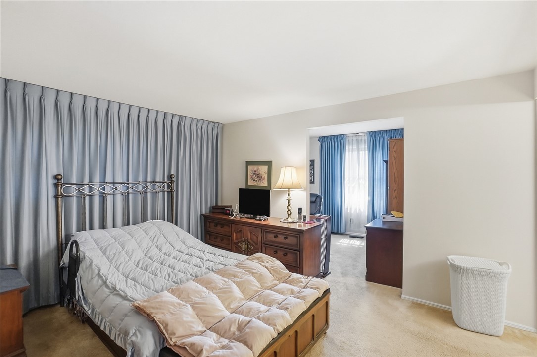 6225 Possum Run Road Bellbrook, OH 45305 - Photo 16 of 33 This bright bedroom provides ample space for rest and relaxation.