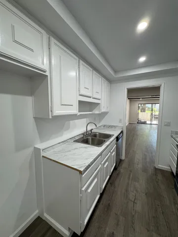 a view of a backyard with swimming pool