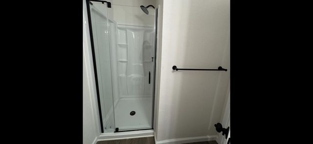 a view of hallway with wooden floor
