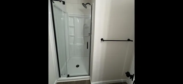 a view of hallway with wooden floor