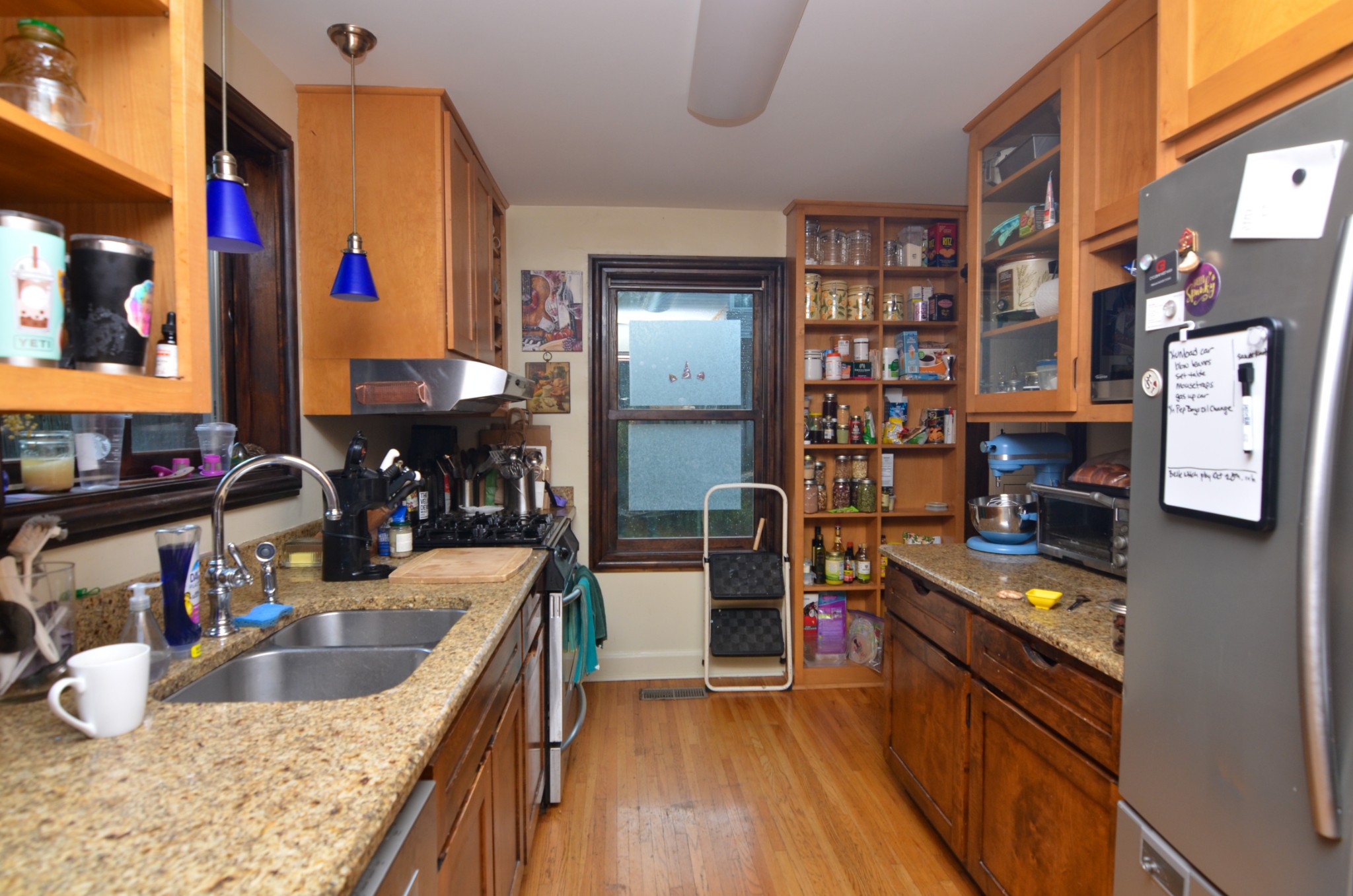 3434 Stokesmont Road Nashville, TN 37215 - Photo 12 of 29 a kitchen filled a counter top space a stove and a wooden floor
