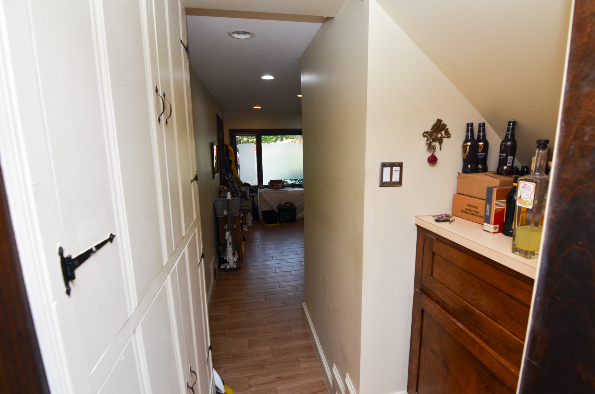3434 Stokesmont Road Nashville, TN 37215 - Photo 14 of 29 a view of a hallway to a livingroom with wooden floor and furniture