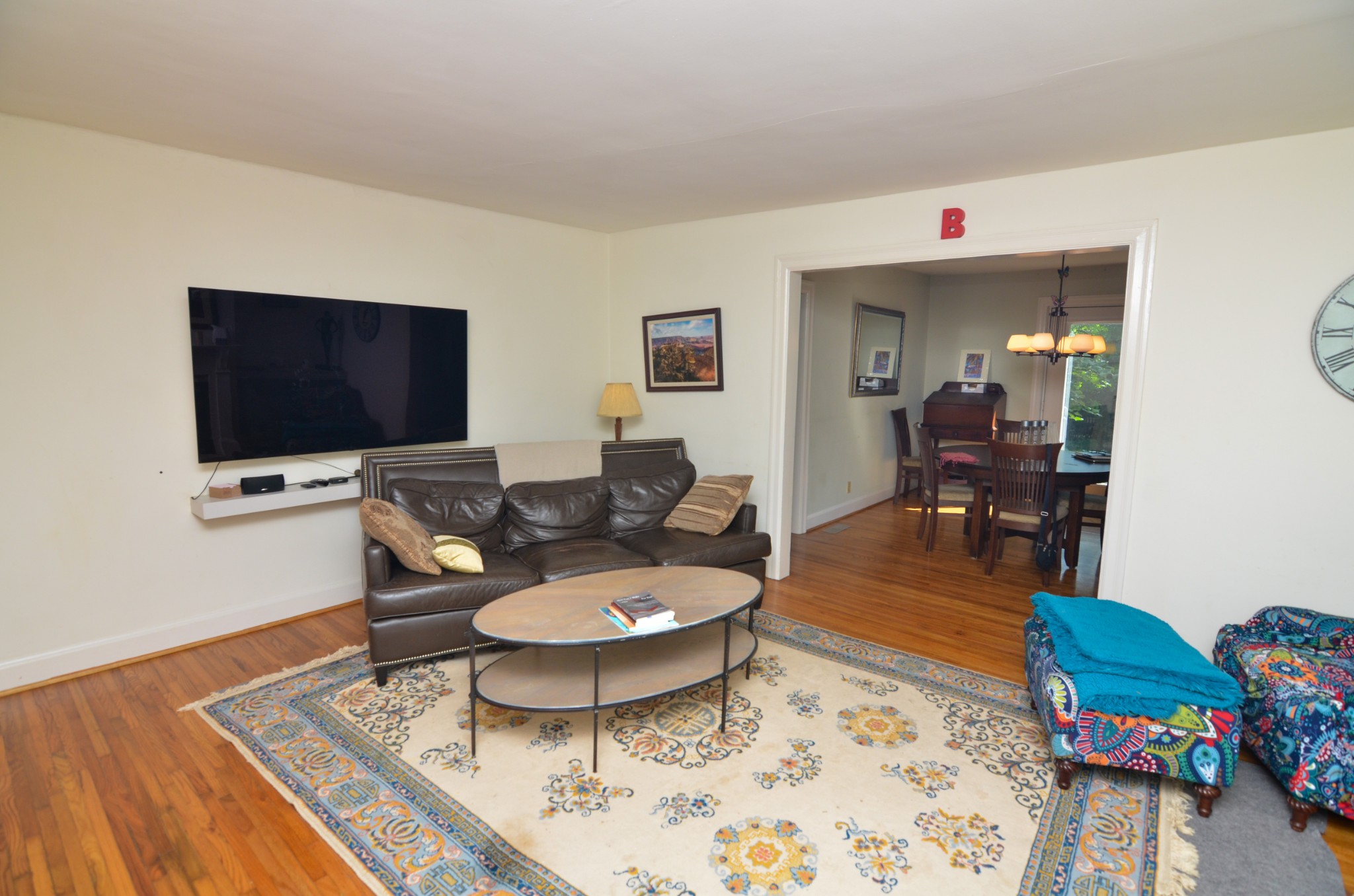 3434 Stokesmont Road Nashville, TN 37215 - Photo 4 of 29 a living room with furniture and a flat screen tv