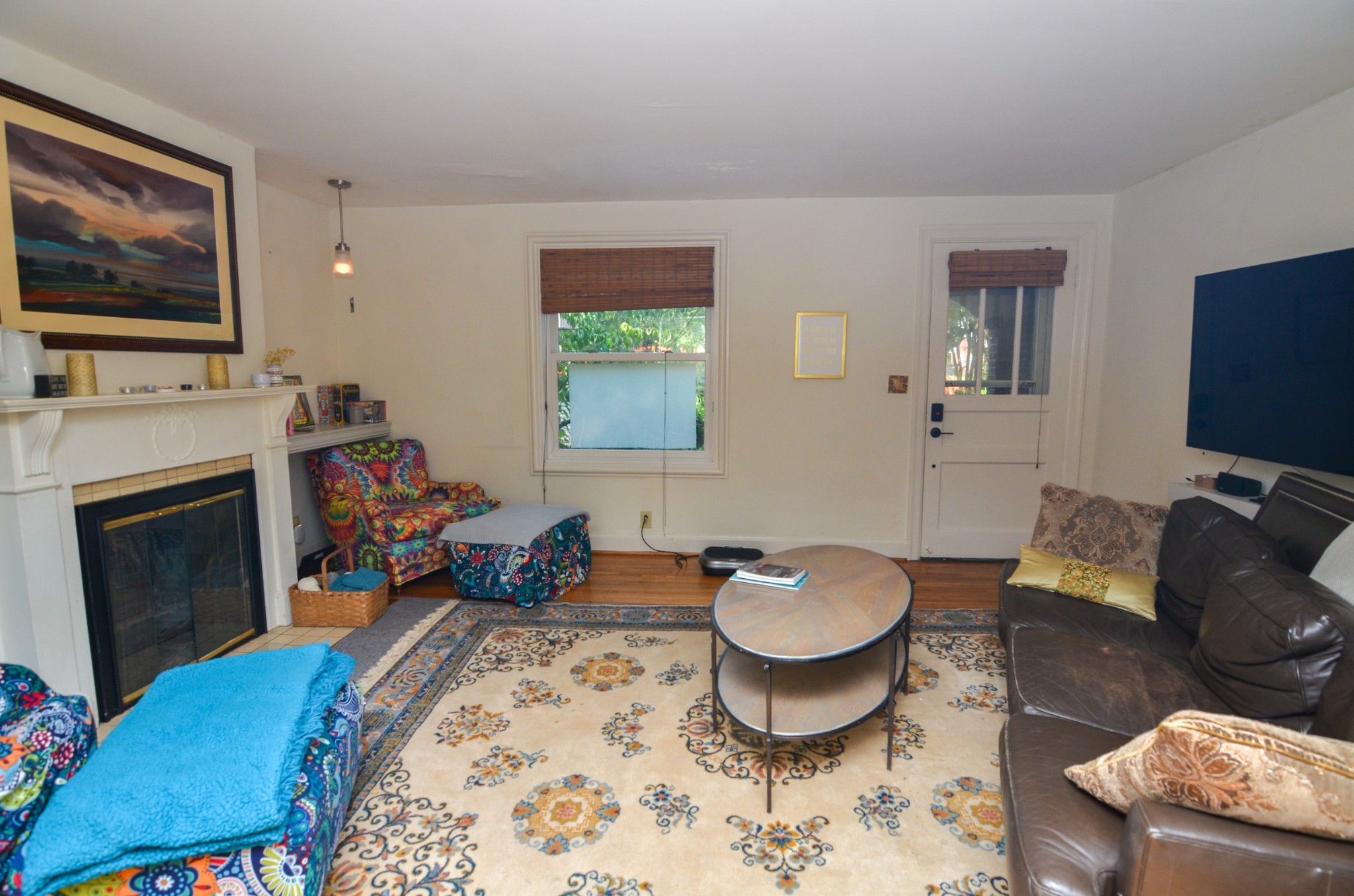 3434 Stokesmont Road Nashville, TN 37215 - Photo 5 of 29 a living room with furniture a flat screen tv and a fireplace