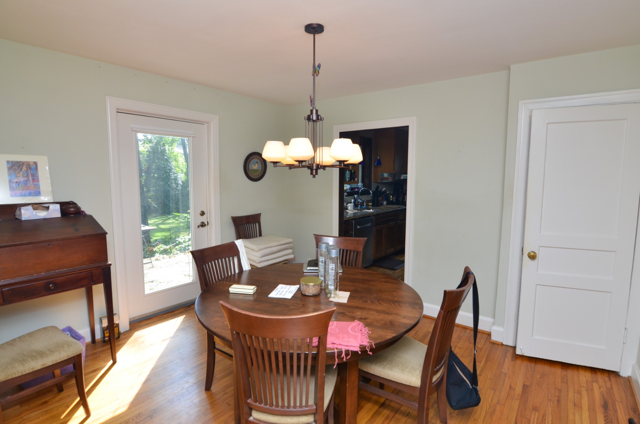 3434 Stokesmont Road Nashville, TN 37215 - Photo 10 of 29 a dining room with furniture a chandelier and wooden floor